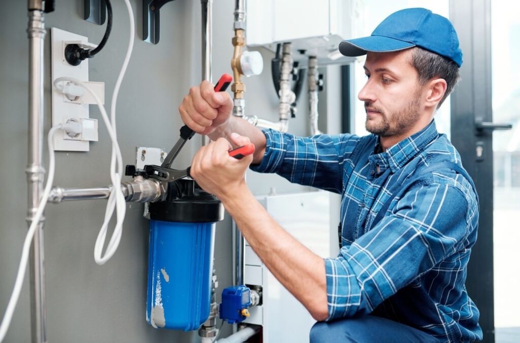 Saving Plumbing technician performing plumber service in Markham, ON using professional plumbing tools to repair pipes, resolve leaks, and maintain reliable water systems.